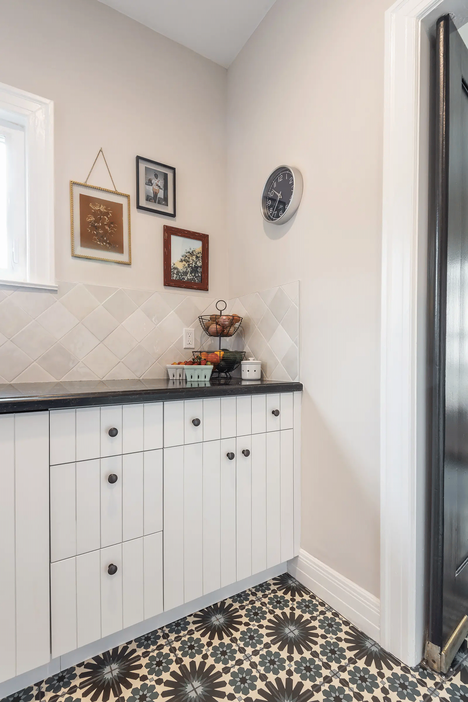 white beadboard cabinet doors with black hardware and pull out drawers in kitchen remodel