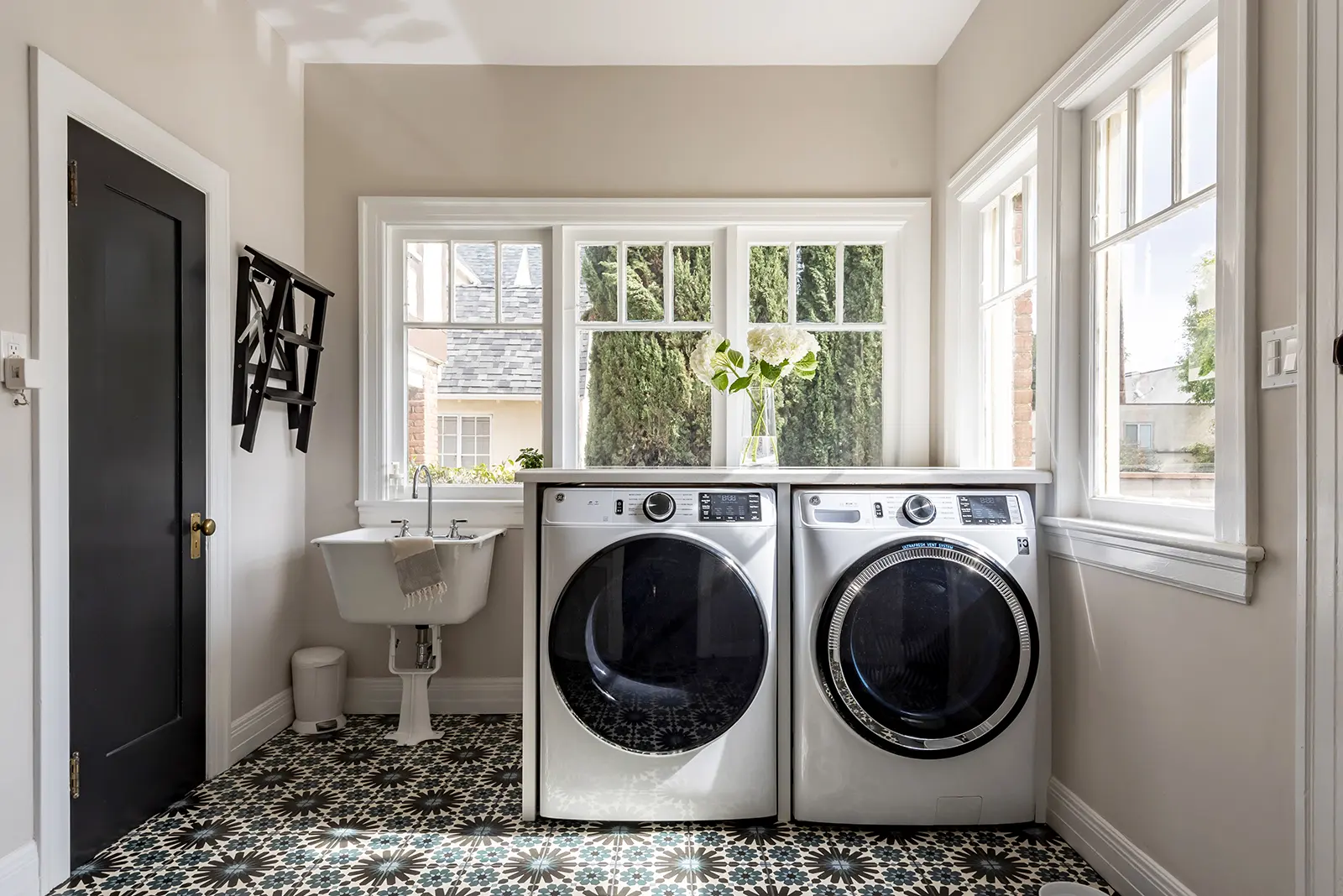 laundry room with patterned floor tile in home remodel in mid city