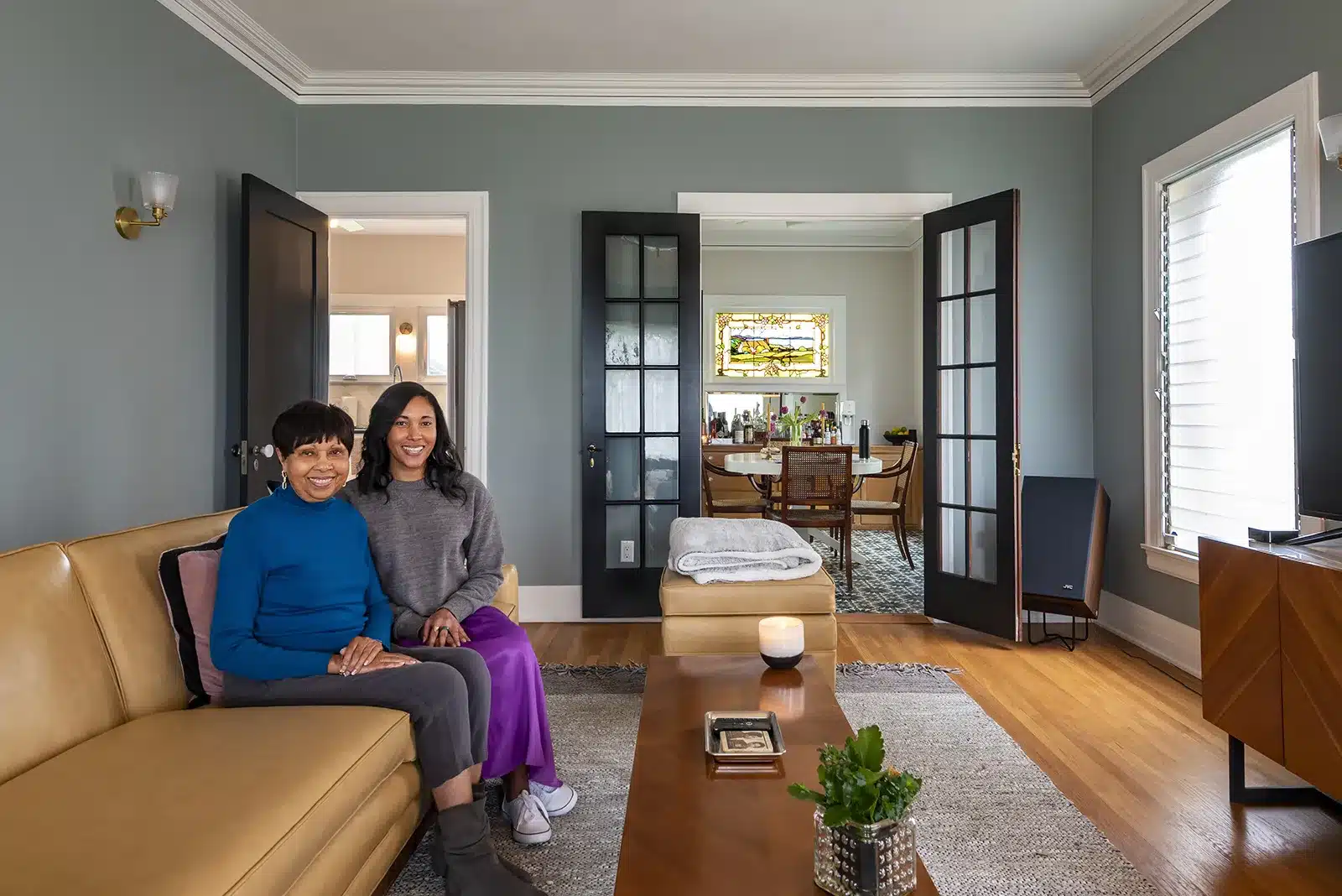 portrait of homeowners in 1920s house after remodel