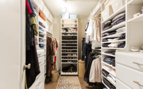 Walk-in closet with lighting and shelves for storage