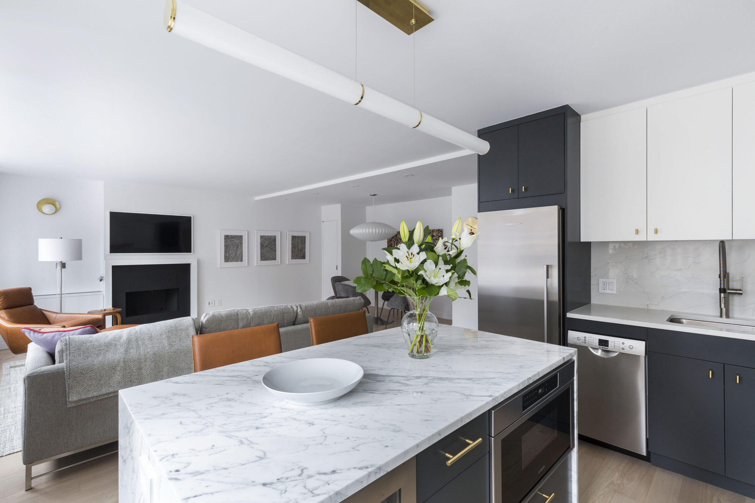 Calacatta marble kitchen island with bouquet of flowers