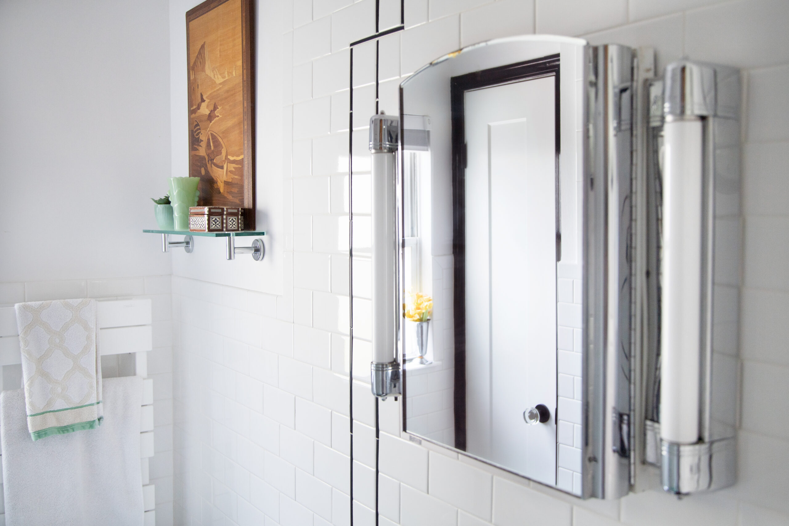 Renovated bathroom with medicine cabinet and mirror with lights