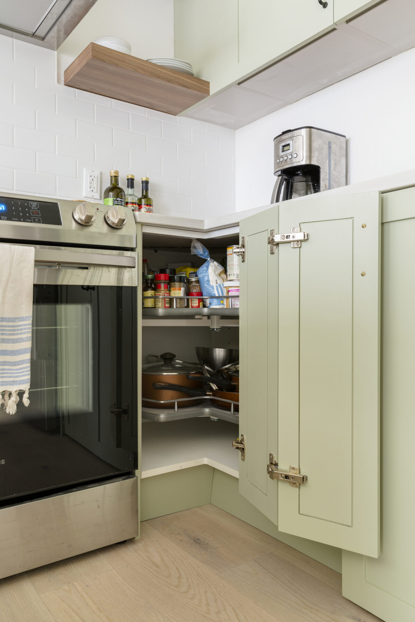 Abbey corner kitchen cabinet with built-in swivel corner shelves